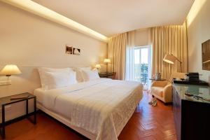 Cama ou camas em um quarto em Penina Hotel & Golf Resort