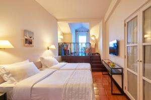 Cama ou camas em um quarto em Penina Hotel & Golf Resort