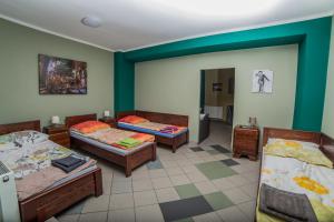 Posteľ alebo postele v izbe v ubytovaní Noclegi Andersa