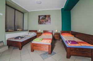 Posteľ alebo postele v izbe v ubytovaní Noclegi Andersa