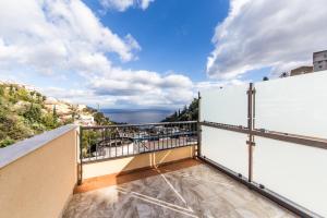 a balcony with a view of the ocean at Il piccolo Diavolo in Taormina