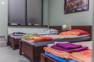 Posteľ alebo postele v izbe v ubytovaní Noclegi Andersa