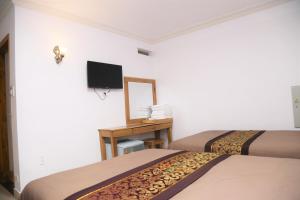TV a/nebo společenská místnost v ubytování Phu Tho Da Lat Hotel