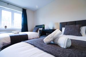 Posteľ alebo postele v izbe v ubytovaní Royal Oak Home