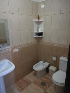 a bathroom with a toilet and a sink at Apartment South Tenerife in San Isidro