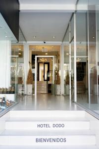 a hotel dodo storefront with stairs in front of a store at Dodo Suites in Mar del Plata