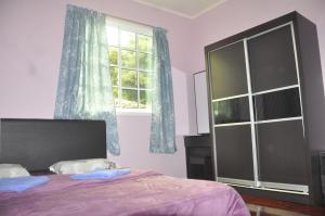Postel nebo postele na pokoji v ubytování Azrien Homestay Kundasang