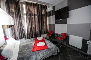 Postel nebo postele na pokoji v ubytování Trendy Living in Monastiraki