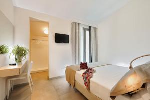 Postel nebo postele na pokoji v ubytování Hotel & Residence Cavalluccio Marino