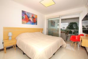 Cama o camas de una habitación en Monet Art - Apartamentos de diseño en Punta del Este