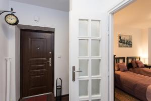 Posteľ alebo postele v izbe v ubytovaní Fiesta Apartament