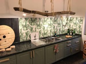 a kitchen with a sink and a counter top at Cactus Host in Las Palmas de Gran Canaria