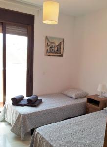 Posteľ alebo postele v izbe v ubytovaní Apartamento con Terraza a 5 min playa