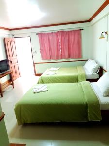 Postel nebo postele na pokoji v ubytování Rayong Phurua Resort