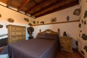 Casa Rural La Pagarrona tesisinde bir odada yatak veya yataklar