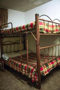 a couple of bunk beds in a room at Hotel Pacifico in Palmira