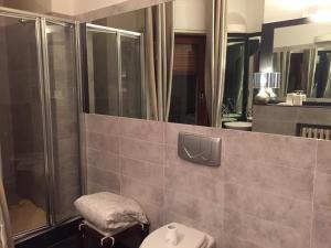 a bathroom with a shower and a toilet and a sink at Little Prive Near Lake Maggiore in Verbania +88 photos