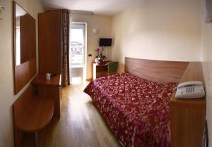 Postel nebo postele na pokoji v ubytování Hotel Brennero