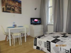 Telewizja i/lub zestaw kina domowego w obiekcie Stay99