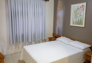 Postel nebo postele na pokoji v ubytování Hotel Abib