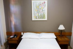 Postel nebo postele na pokoji v ubytování Hotel Abib