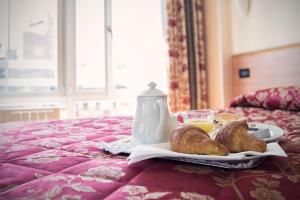 Postel nebo postele na pokoji v ubytování Hotel Brennero