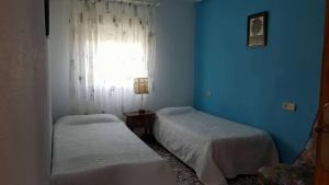 A bed or beds in a room at Casa de los amigos Még 14 kép