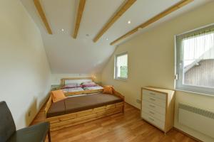 Voodi või voodid majutusasutuse Katschberg Appartements toas