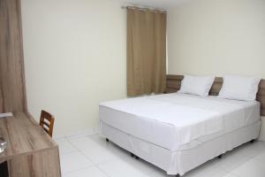 Postel nebo postele na pokoji v ubytování Hotel Executive