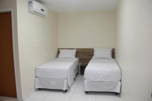 Postel nebo postele na pokoji v ubytování Hotel Executive