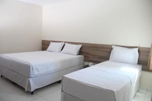 Postel nebo postele na pokoji v ubytování Hotel Executive