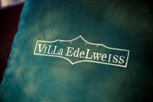 a book with the word wildlife edelweiss on it at Villa Edelweiss in Sveti Stefan