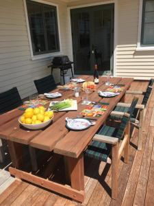 a wooden table with a bowl of fruit on a deck at Pahau Downs in Culverden