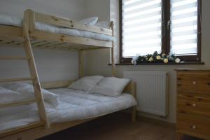 Posteľ alebo postele v izbe v ubytovaní Apartament Akuratny Zakopane
