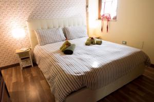 Ένα ή περισσότερα κρεβάτια σε δωμάτιο στο Casa la Quiete
