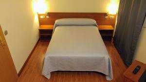 Postel nebo postele na pokoji v ubytování Hostal Prada Borges