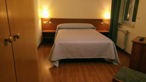 Postel nebo postele na pokoji v ubytování Hostal Prada Borges
