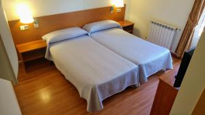 Postel nebo postele na pokoji v ubytování Hostal Prada Borges