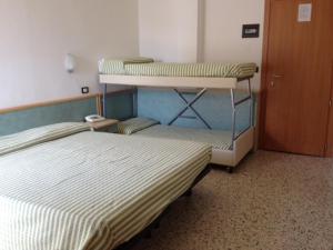 Postel nebo postele na pokoji v ubytování Hotel Garden