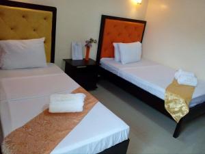 Postel nebo postele na pokoji v ubytování RSG Microhotel