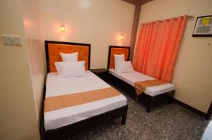 Postel nebo postele na pokoji v ubytování RSG Microhotel