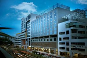 a rendering of a building with a street at V Hotel Bencoolen in Singapore