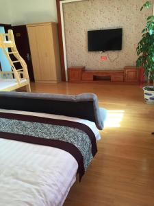 Säng eller sängar i ett rum på Wuyuan Man Shan Inn