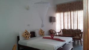 Cama o camas de una habitación en Oasis Beach Resort
