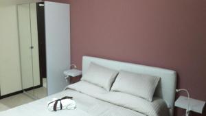 A bed or beds in a room at Il Centro Short Lets