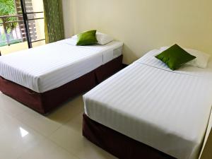 Postel nebo postele na pokoji v ubytování T.P. Place Hotel
