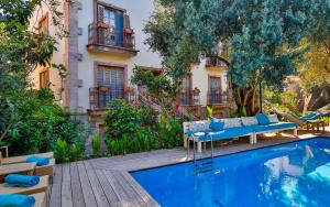 a swimming pool in front of a building at Oyster Residences - Adult Only in Oludeniz