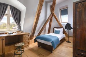 Łóżko lub łóżka w pokoju w obiekcie Relais & Châteaux Hotel Quadrille - Adults Only