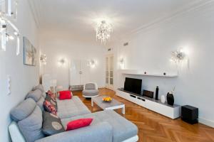 a living room with a couch and a tv at Apartment Saint Philippe 2 in Nice