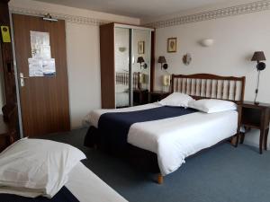 Postel nebo postele na pokoji v ubytování La Bonne Franquette
